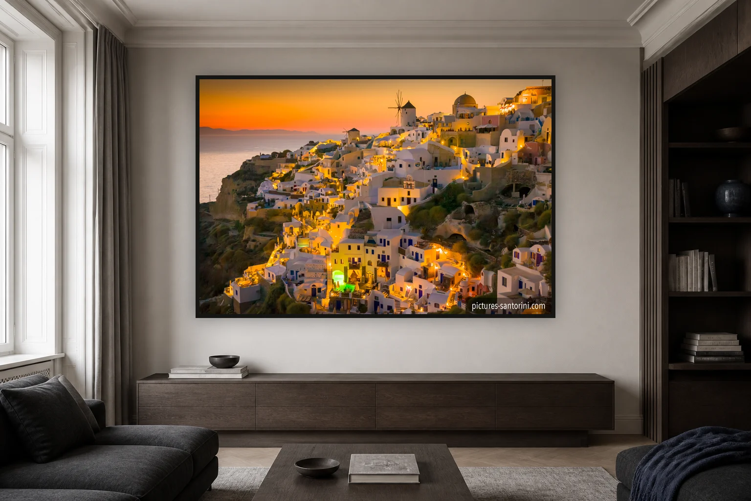Concept mockup of an Oia sunset photograph as a large metal print in a quiet living room