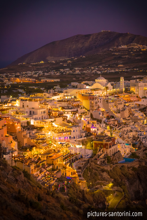 Fira, the modern capital of Santorini at night as seen from the north