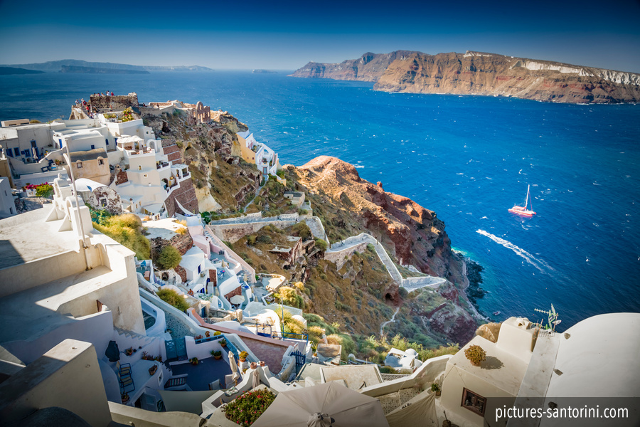 Oia the beautiful and picturesque village situated in the northern part of Santorini in front of the Caldera and the deep blue sea