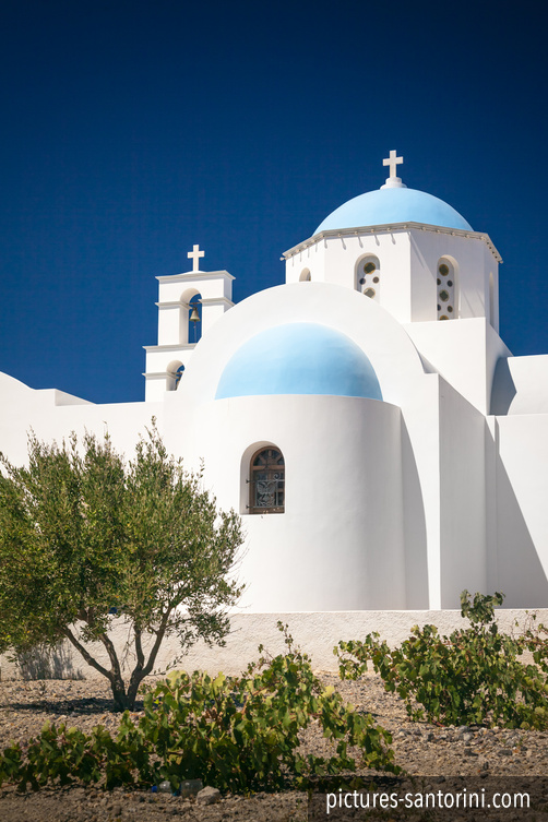 One of the many typical Greek churches on Santorini, Greece. This photo was taken next to Megalochori Village